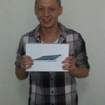 Photo of grinning first tablet raffle winner