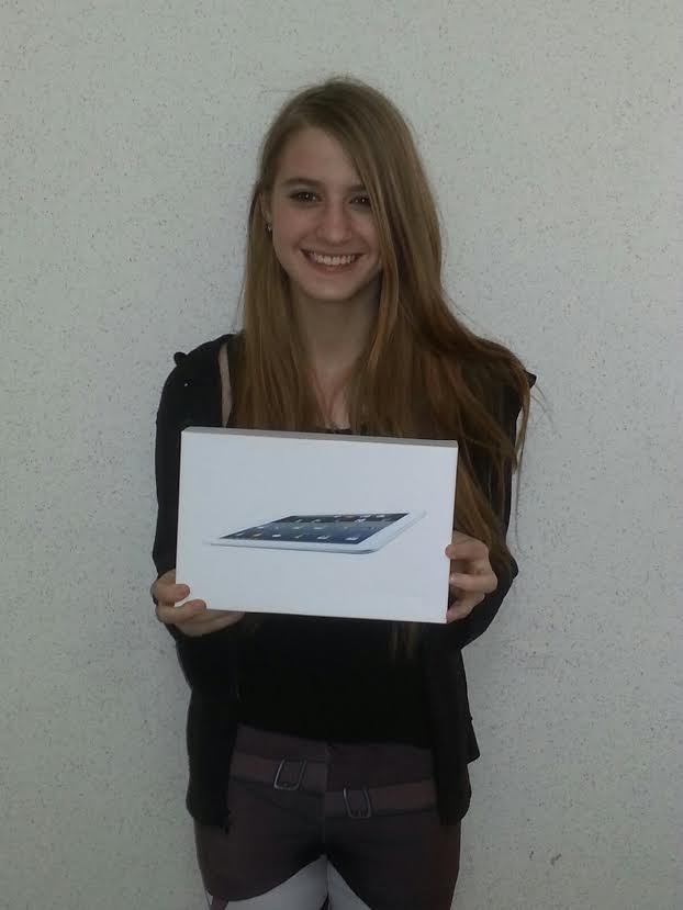 Photo of smiling tablet raffle winner